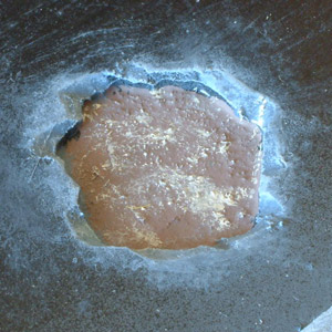 Close-up of a small crater