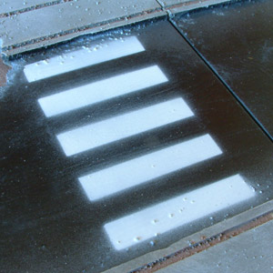 Close-up of a pedestrian crossing painted on the street